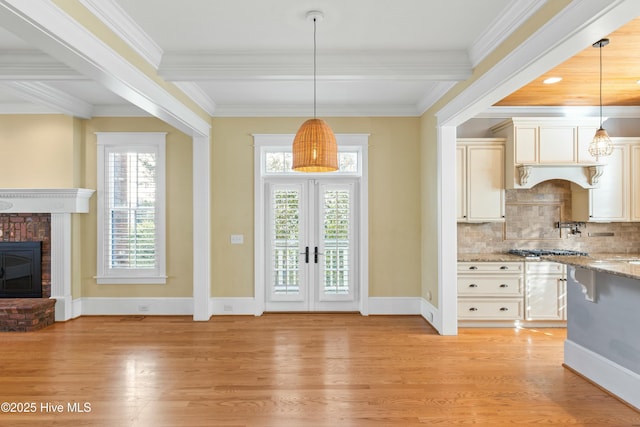 1037 Anchors Bend Way, Wilmington, NC 28411 - kitchen with decorative backsplash, a healthy amount of sunlight, french doors, and light wood finished floors