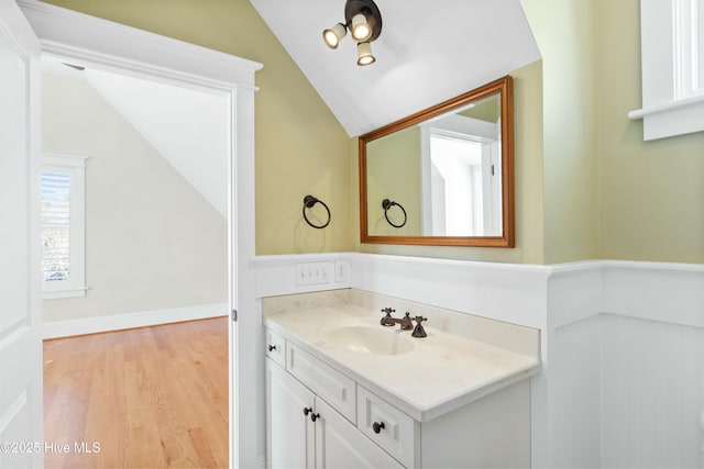 1037 Anchors Bend Way, Wilmington, NC 28411 - bathroom featuring wood finished floors, lofted ceiling, and vanity