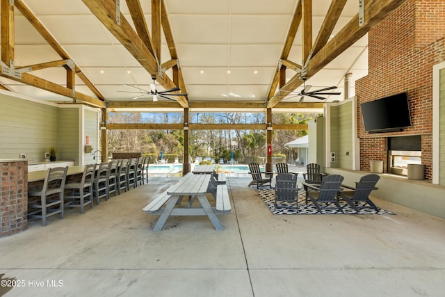 1037 Anchors Bend Way, Wilmington, NC 28411 - view of patio featuring a ceiling fan, a community pool, and exterior bar