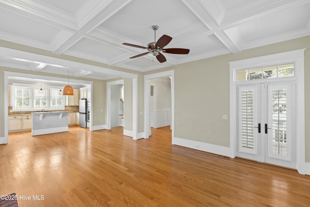 1037 Anchors Bend Way, Wilmington, NC 28411 - unfurnished living room featuring plenty of natural light, a ceiling fan, coffered ceiling, and crown molding