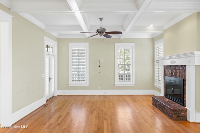 1037 Anchors Bend Way, Wilmington, NC 28411 - unfurnished living room featuring light wood-style floors, a brick fireplace, and beamed ceiling