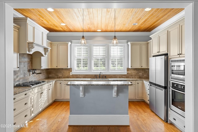 1037 Anchors Bend Way, Wilmington, NC 28411 - kitchen featuring wood ceiling, cream cabinets, light stone counters, a sink, and appliances with stainless steel finishes