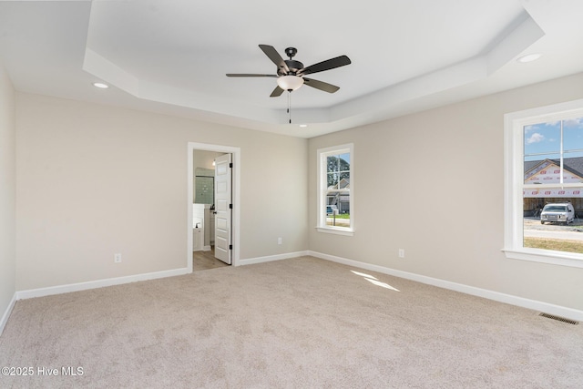 30 Tee Dr, Selma, NC 27576 - carpeted empty room featuring a tray ceiling, visible vents, ceiling fan, and recessed lighting