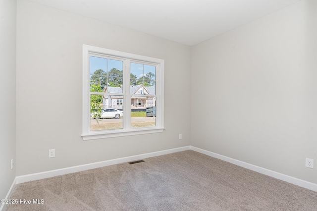 30 Tee Dr, Selma, NC 27576 - spare room featuring carpet, visible vents, and baseboards