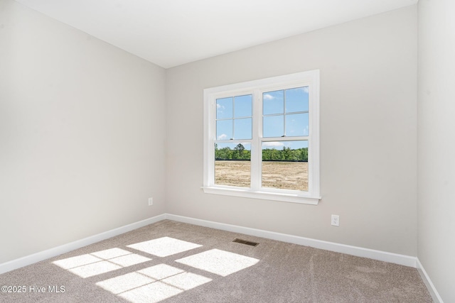 30 Tee Dr, Selma, NC 27576 - unfurnished room with visible vents, carpet flooring, and baseboards