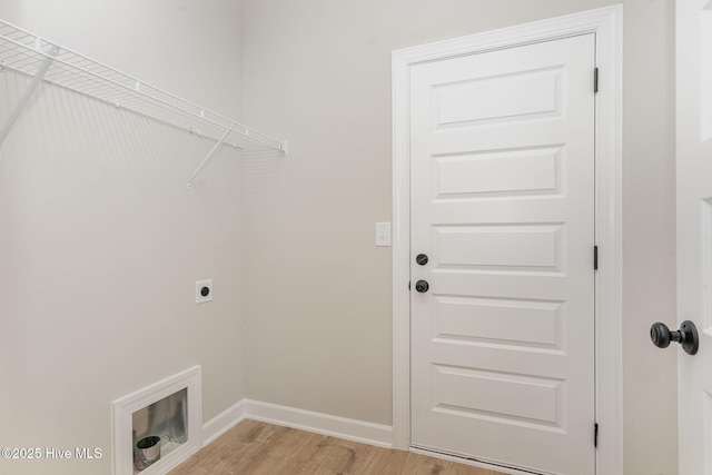 30 Tee Dr, Selma, NC 27576 - washroom featuring light wood finished floors, baseboards, electric dryer hookup, and laundry area