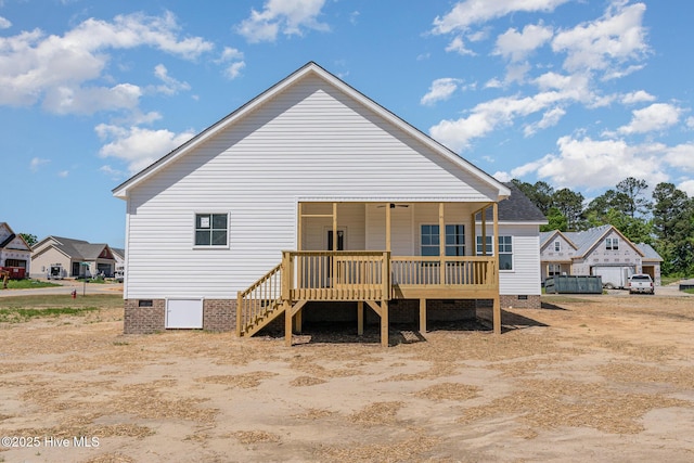 30 Tee Dr, Selma, NC 27576 - rear view of property featuring crawl space, stairs, and a wooden deck