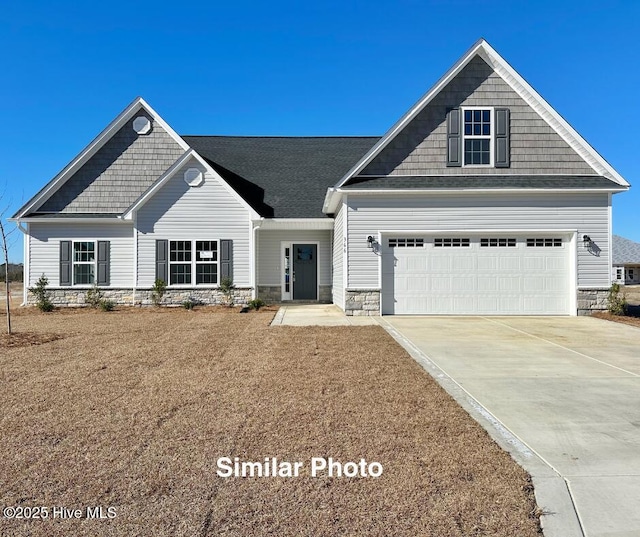 745 Secession Ln, Jacksonville, NC 28546 - craftsman-style home with driveway and stone siding