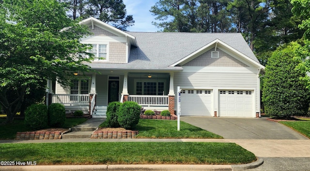 2429 Falls River Ave, Raleigh, NC 27614 - craftsman inspired home with an attached garage, driveway, roof with shingles, covered porch, and a front yard