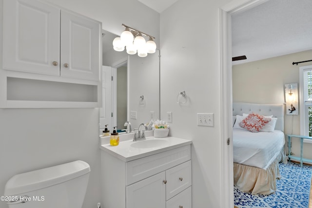 222 NE 36th St, Oak Island, NC 28465 - ensuite bathroom featuring toilet, vanity, and connected bathroom