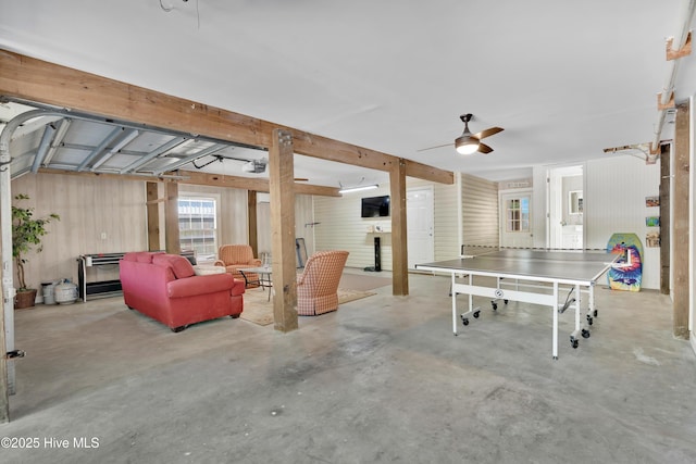 222 NE 36th St, Oak Island, NC 28465 - playroom featuring a ceiling fan and concrete floors