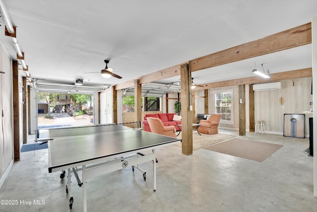 222 NE 36th St, Oak Island, NC 28465 - rec room featuring finished concrete floors and a ceiling fan