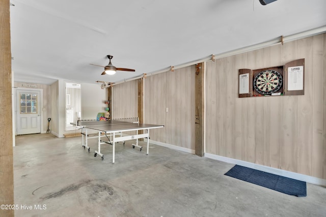 222 NE 36th St, Oak Island, NC 28465 - recreation room with concrete floors and a ceiling fan