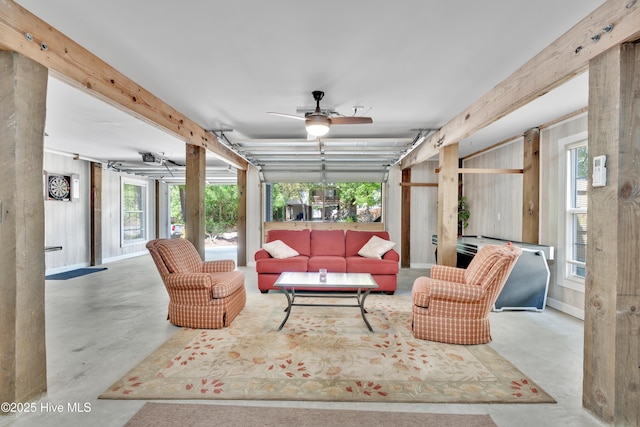 222 NE 36th St, Oak Island, NC 28465 - living area with concrete floors and a ceiling fan