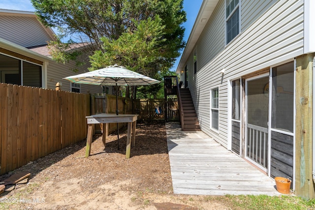 222 NE 36th St, Oak Island, NC 28465 - view of yard with fence, stairs, and a wooden deck