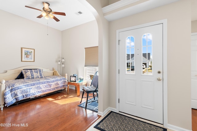 659 Meadowbrook Ln NW, Calabash, NC 28467 - entryway featuring ceiling fan, wood finished floors, baseboards, and arched walkways