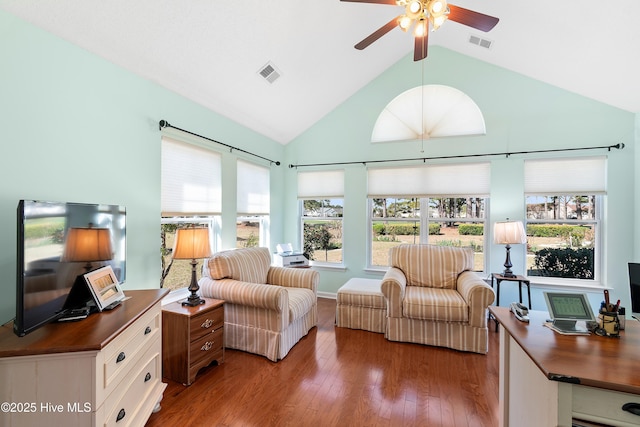 659 Meadowbrook Ln NW, Calabash, NC 28467 - living room with wood finished floors, ceiling fan, and high vaulted ceiling