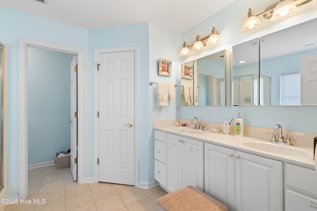 659 Meadowbrook Ln NW, Calabash, NC 28467 - bathroom with tile patterned flooring, an enclosed shower, double vanity, and baseboards