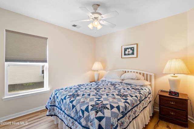 659 Meadowbrook Ln NW, Calabash, NC 28467 - bedroom with wood finished floors, baseboards, and a ceiling fan