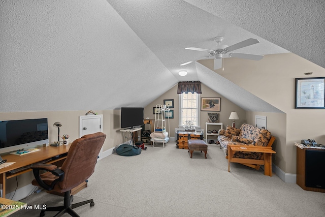 home office featuring lofted ceiling, carpet flooring, baseboards, and ceiling fan