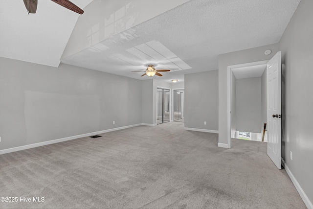 6211 Wrightsville Ave Unit 111, Wilmington, NC 28403 - spare room featuring ceiling fan, carpet, a textured ceiling, and a smoke detector