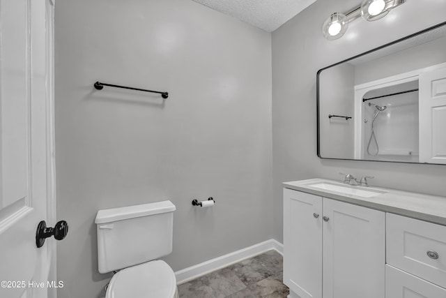 6211 Wrightsville Ave Unit 111, Wilmington, NC 28403 - full bathroom with vanity, a textured ceiling, and a shower