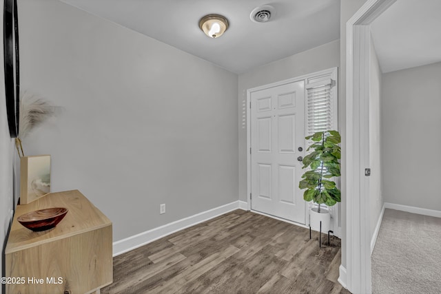 6211 Wrightsville Ave Unit 111, Wilmington, NC 28403 - foyer featuring baseboards and wood finished floors