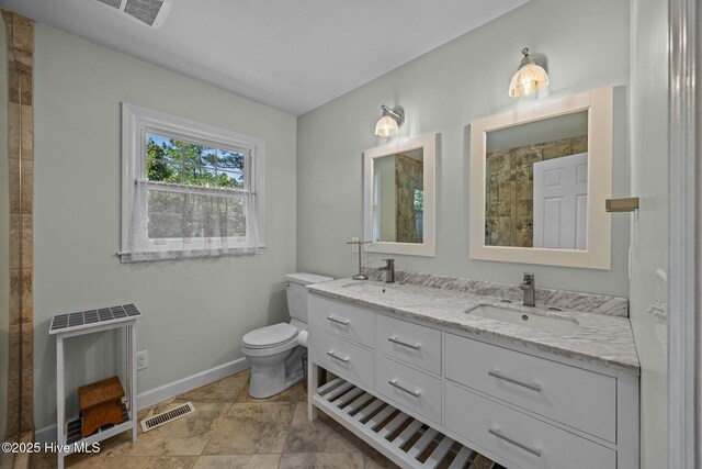 full bath with visible vents, a sink, and toilet