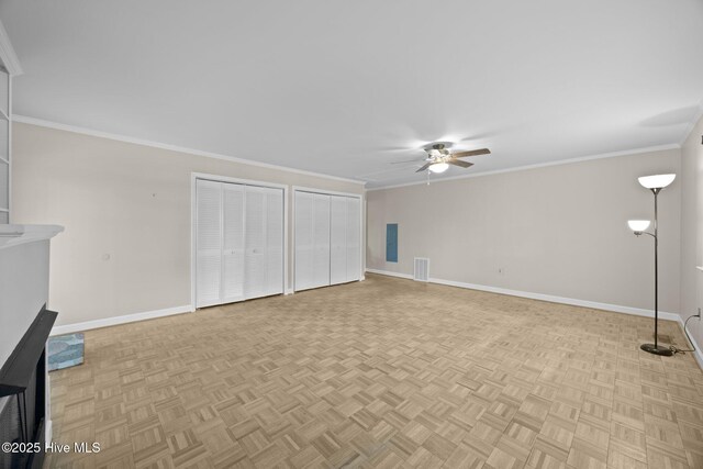 unfurnished living room with ceiling fan, visible vents, ornamental molding, and baseboards