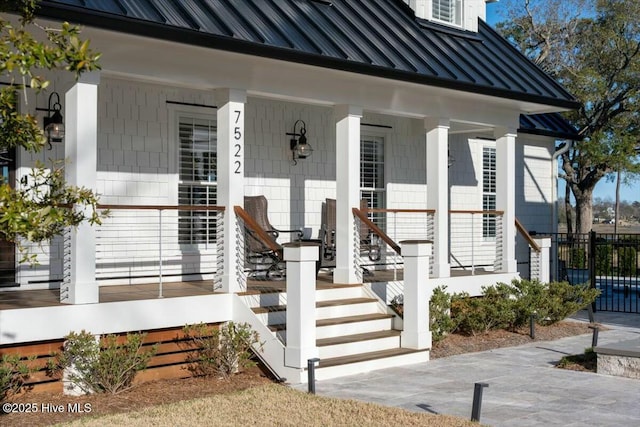 7522 Dunbar Rd, Wilmington, NC 28411 - property entrance with a standing seam roof, a metal roof, and a porch