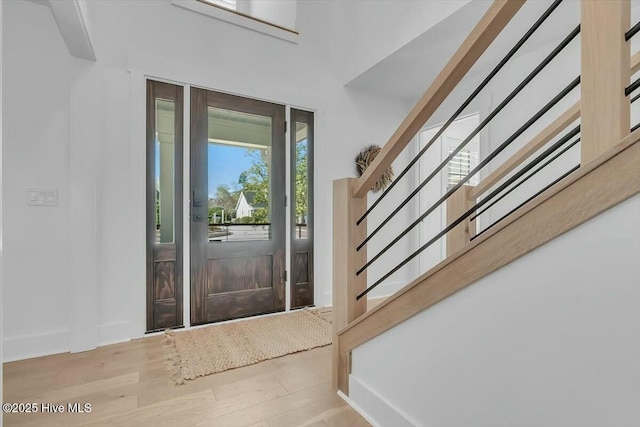 7522 Dunbar Rd, Wilmington, NC 28411 - entrance foyer featuring stairs and wood finished floors