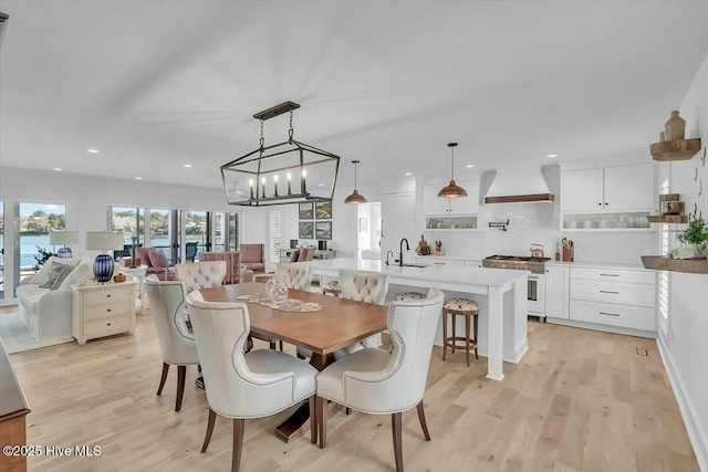 7522 Dunbar Rd, Wilmington, NC 28411 - dining room with recessed lighting, light wood-type flooring, and a chandelier