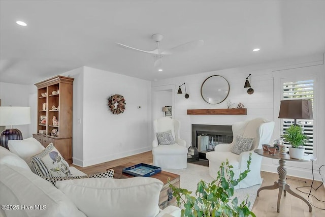 7522 Dunbar Rd, Wilmington, NC 28411 - living area with wood finished floors, recessed lighting, a ceiling fan, and a glass covered fireplace