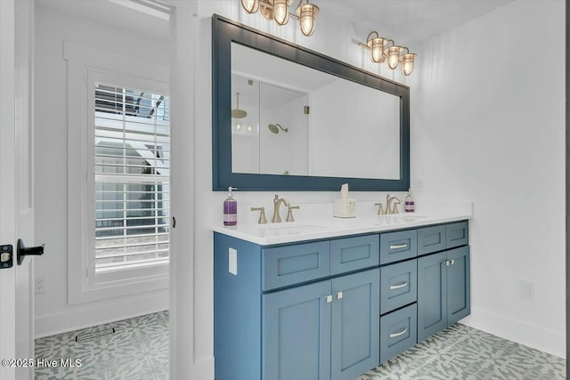 7522 Dunbar Rd, Wilmington, NC 28411 - bathroom with double vanity, tile patterned floors, and a shower