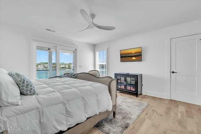 7522 Dunbar Rd, Wilmington, NC 28411 - bedroom featuring access to exterior, light wood finished floors, and ceiling fan