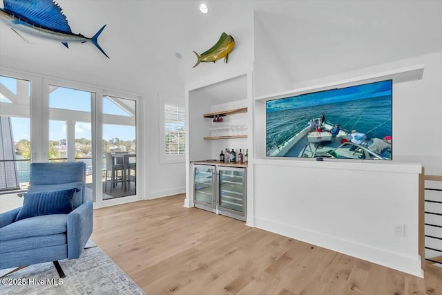 7522 Dunbar Rd, Wilmington, NC 28411 - indoor dry bar featuring beverage cooler and wood finished floors