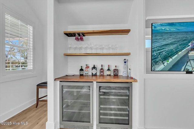 7522 Dunbar Rd, Wilmington, NC 28411 - indoor dry bar with beverage cooler and wood finished floors