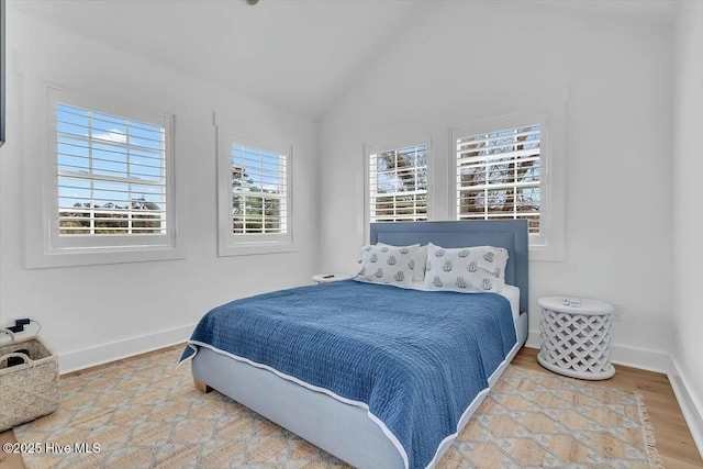 7522 Dunbar Rd, Wilmington, NC 28411 - bedroom featuring lofted ceiling and wood finished floors