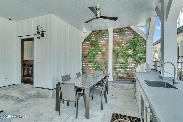 7522 Dunbar Rd, Wilmington, NC 28411 - view of patio / terrace with ceiling fan, outdoor dining area, and an outdoor kitchen