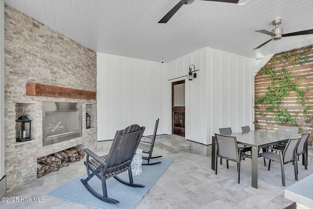 7522 Dunbar Rd, Wilmington, NC 28411 - view of patio featuring a fireplace, a ceiling fan, and outdoor dining area