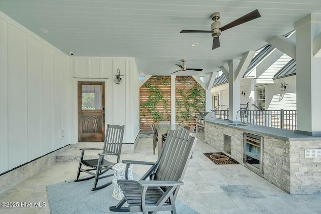 7522 Dunbar Rd, Wilmington, NC 28411 - view of patio / terrace with wine cooler, ceiling fan, and area for grilling