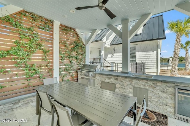 7522 Dunbar Rd, Wilmington, NC 28411 - view of patio featuring exterior kitchen, outdoor dining area, beverage cooler, and ceiling fan