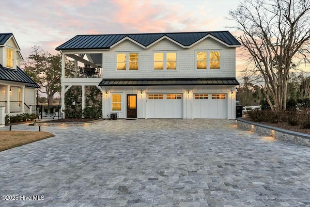 7522 Dunbar Rd, Wilmington, NC 28411 - view of front of property with a standing seam roof, a metal roof, and decorative driveway