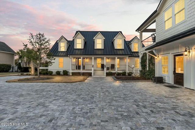 7522 Dunbar Rd, Wilmington, NC 28411 - view of front facade with a standing seam roof, a porch, and a metal roof