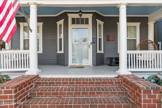 doorway to property featuring a porch
