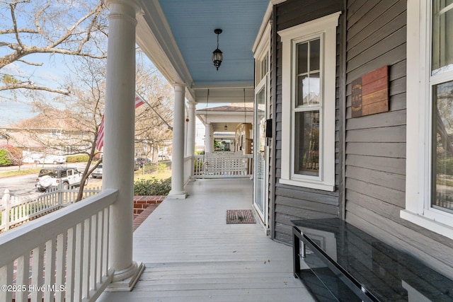 wooden terrace featuring a porch