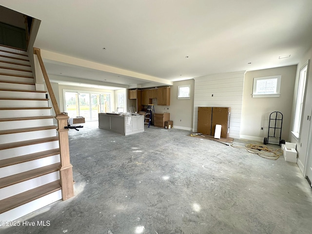 110 Blimp View Dr, Elizabeth City, NC 27909 - unfurnished living room with stairs and healthy amount of natural light