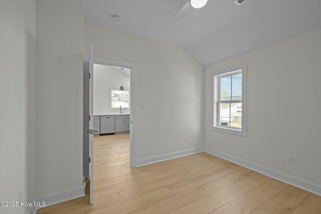 1615 Live Oak St Unit A & B, Beaufort, NC 28516 - spare room featuring a ceiling fan, a sink, light wood-style floors, baseboards, and vaulted ceiling