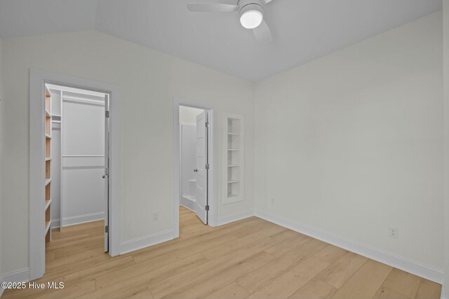 1615 Live Oak St Unit A & B, Beaufort, NC 28516 - unfurnished bedroom with a walk in closet, light wood-style flooring, baseboards, and a closet