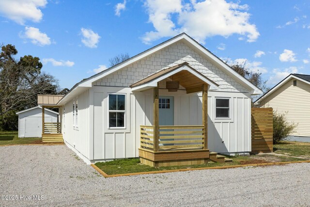 1615 Live Oak St Unit A & B, Beaufort, NC 28516 - view of front of property with board and batten siding, gravel driveway, and an outdoor structure